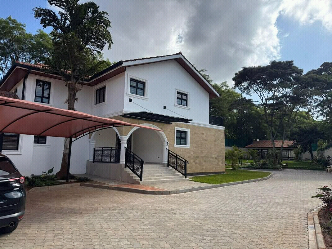 7 bedroom luxury residence Sunken lounge with fireplace opening to a covered patio & gardens
